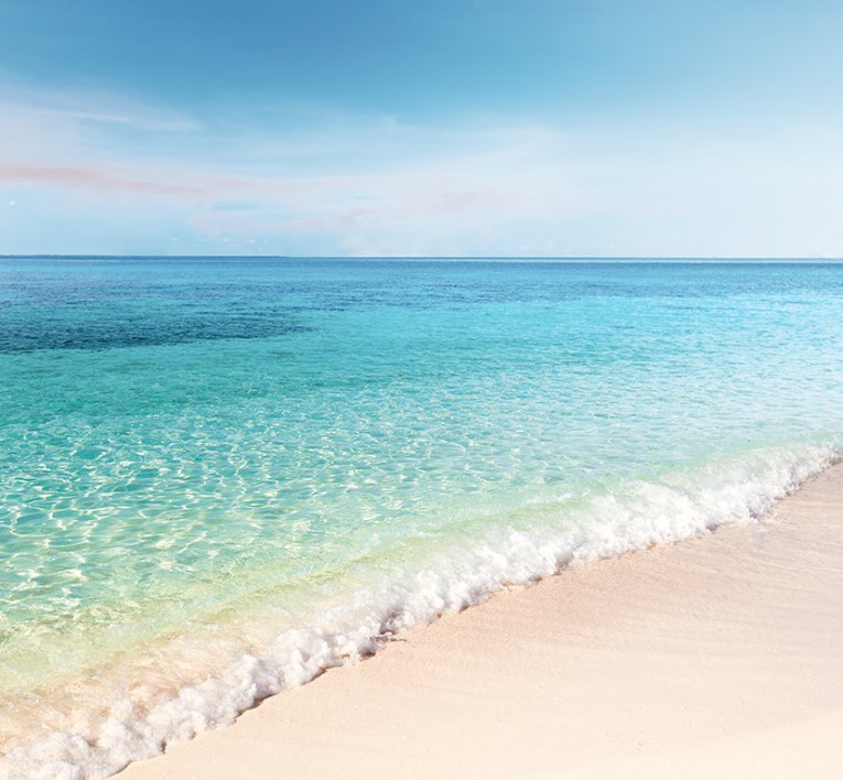 image of a the ocean and some of the sand on the shore