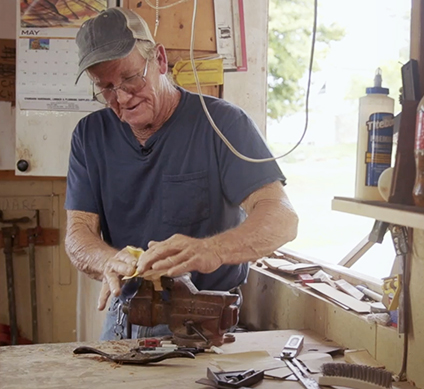 Man working on a wood carving