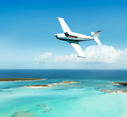 sea plane flying over clear waters 