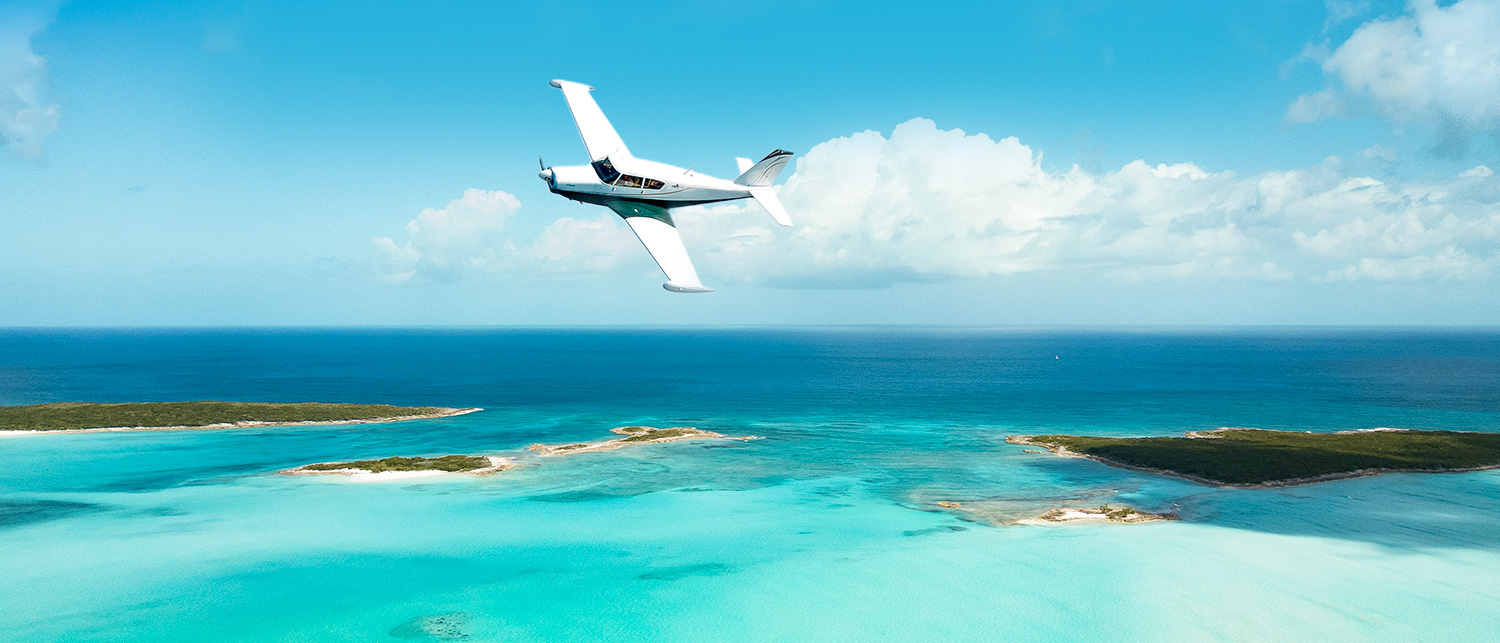 sea plane flying over clear waters 