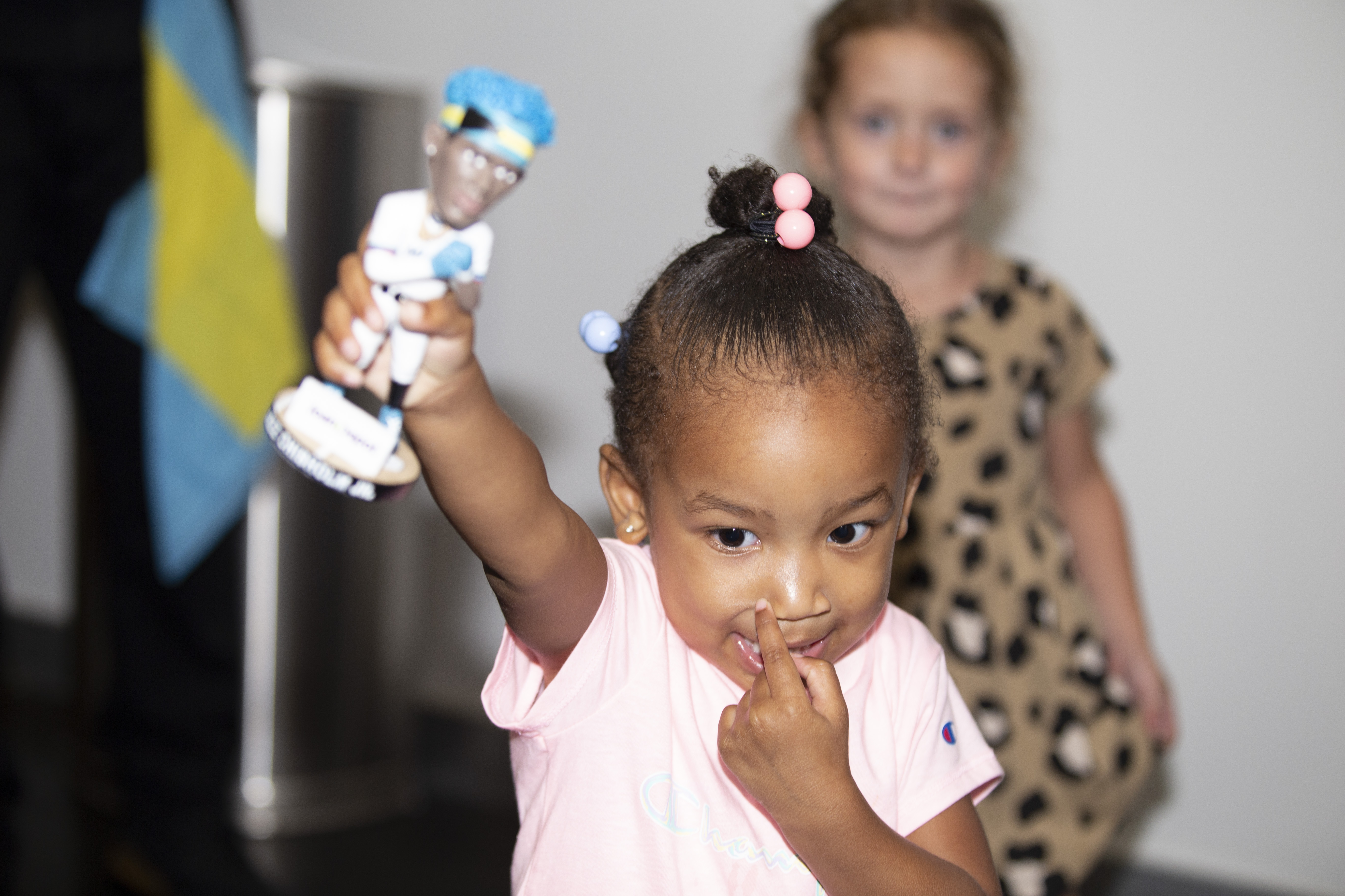 two year old luna marshall shows off her jazz bobblehead